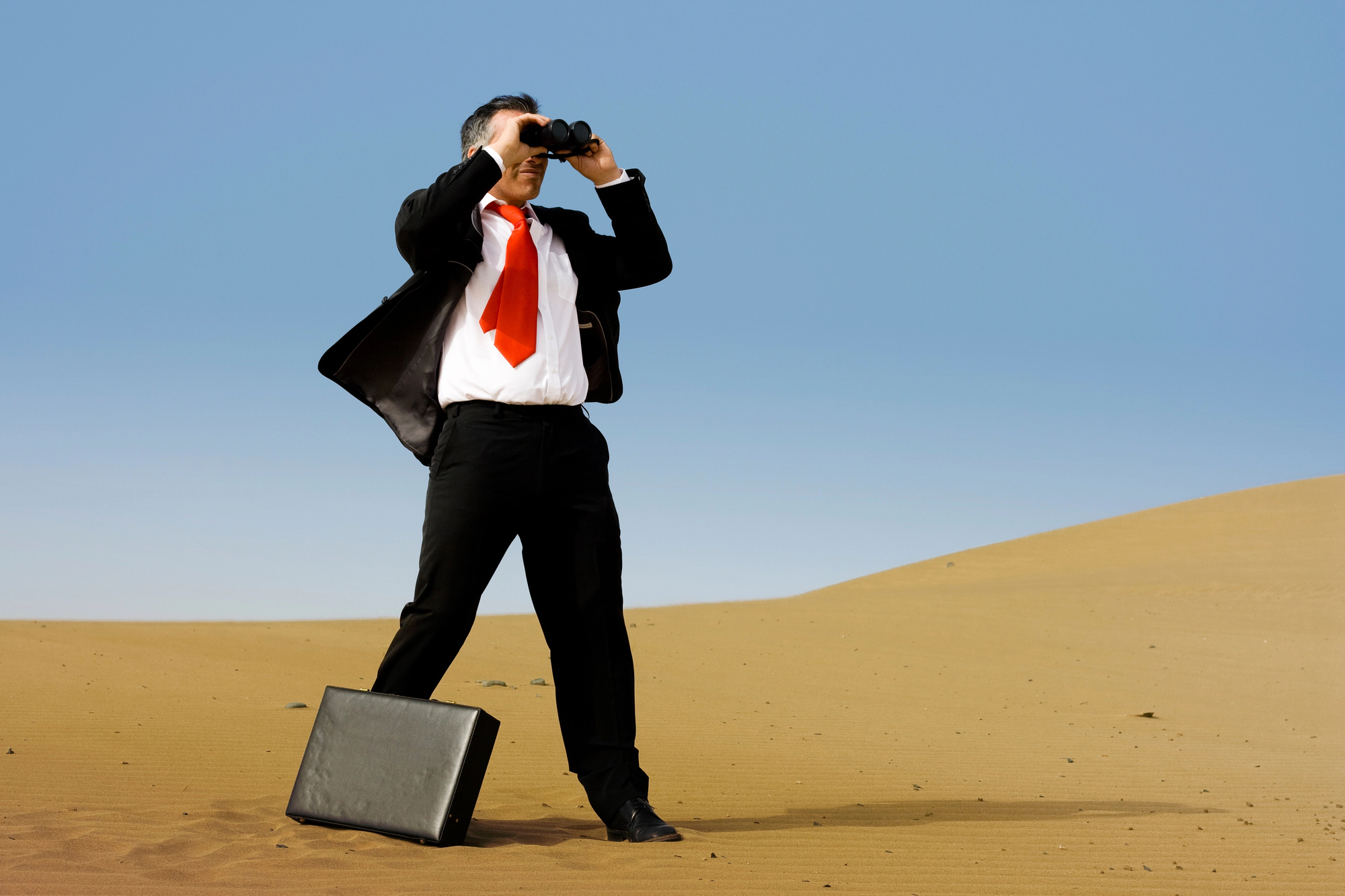 BusinessMan-in-Desert-with-Binoculars