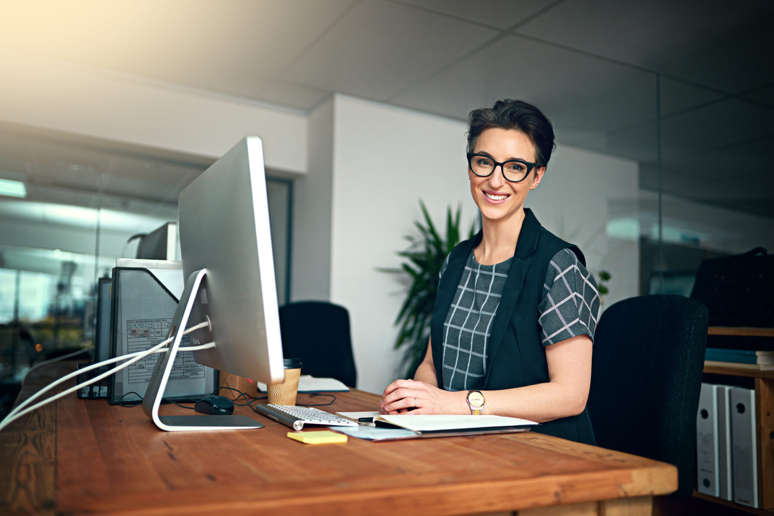 Smile, computer and portrait of woman in office for creative research with project online. Happy, technology and female copywriting editor from Canada working on web design on pc in workplace.